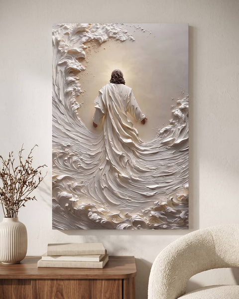 White sculptural impasto canvas of Jesus walking into a wave, hung above a walnut console