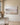 Misty meadow and lake landscape canvas with Be Still and Know Psalm 46:10 hanging on an oat limewashed plaster wall