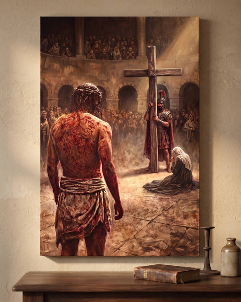 Realist canvas of Christ seen from behind walking toward the cross, hung straight-on above a walnut console