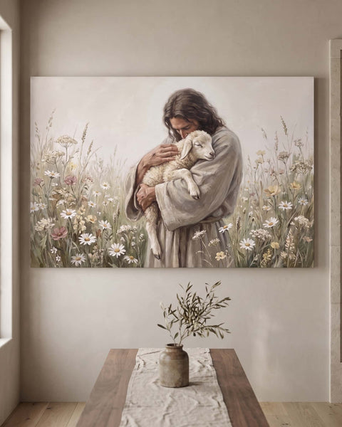 Jesus holding a sleeping lamb in a wildflower meadow, 36x24 inch canvas hung flat on a limewashed greige plaster wall