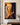 Jesus casting out a demon oil painting on canvas hanging on a bone white limewash plaster wall above a walnut console