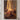 Canvas of a woman's hand touching the glowing hem of Jesus' robe, hung on a warm plaster wall above a walnut console