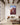 Jehovah Jireh ram canvas hanging above a linen sofa in a Mediterranean living room
