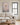 Jesus walking on water canvas above a cream linen sofa in a farmhouse living room