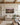 The 36 by 24 inch landscape canvas hanging above a long oatmeal linen sofa in a beamed great room