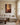 Large 32 by 48 inch canvas of the healing touch on the hem, centered above a linen sectional in a panelled Colonial Revival living room