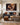 The Missing Piece canvas hanging above a charcoal linen sofa in a transitional living room