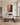 Deliverance canvas art hung above a limestone mantel in a shingle style estate living room with an oatmeal linen sectional