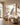 Psalm 91 wall art beside linen armchairs in warm morning light
