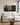 Wide 2:1 Jesus and lost lamb canvas above a linen sectional in a living room