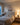 Christian wall art of Jesus and a dove above a bedroom headboard in the evening