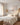 Calming Jesus wall art centered over a linen headboard in a bright white bedroom