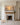 Jesus reaching toward the distant fishing boat, wide canvas displayed above a carved marble fireplace mantel
