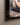 Close-up of the gallery-wrapped canvas corner showing oil brushwork texture and 1.25 inch depth