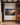 Isaiah 40:31 mountain and eagle canvas between walnut bookcases in a villa library with limestone fireplace