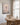 Peace canvas print hanging beside a farmhouse breakfast nook window
