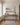 Psalm 46:10 landscape canvas above a white oak console table in a panelled entrance hall