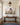 30x20 inch canvas above a walnut console in a panelled entrance hall with morning daylight