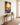 Jesus and the lost lamb canvas above an oak console table in a craftsman entryway foyer