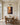 Deliverance oil painting canvas on a panelled dining room wall above an oak table with cane back chairs