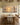 48 by 24 inch panoramic canvas on a limewashed dining room wall above a long oak farm table
