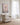 Coastal living room with Jesus walking on the sea canvas near a window