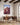 The Lord Will Provide canvas behind a walnut desk in a home office