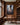 Jesus reaching down into the mire, canvas print on the walnut panelled wall of a home library above a wooden desk