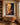 Jesus casting out a demon canvas above an oak desk in a Prairie style study lined with filled bookcases