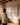 Woman standing beside the canvas showing how wide the piece hangs on a wall