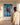 Woman standing beside the canvas showing how tall the piece hangs on a wall