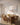 Wide Jesus canvas beside an olive-wood dining table in a sunlit villa dining room