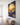 Christian canvas wall art of Jesus running to the lost lamb along a white shiplap farmhouse hallway