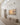 60 by 30 inch panoramic canvas on a tall paneled gallery wall showing its full size in a large hall