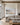 Largest 48 by 32 inch meadow and lake canvas above a long linen sofa in a great room with oak beams