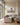 Largest 48x32 inch size shown on a wide plaster wall above a long linen sofa in a hillside great room