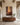 32 by 48 inch canvas of the hem of His garment on a wide plaster wall above a walnut credenza under timber beams