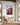 Ram caught in thorns canvas in a bright sunroom with olive trees outside