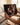 Hands holding the freshly unboxed landscape canvas by its wrapped side edges