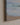 Close-up of the painting-style canvas corner showing waves and shells on wet sand and the 1.25 inch gallery-wrapped edge