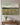 Psalm 46:10 wildflower canvas above a console table in a transitional-style entryway