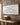 Be Strong and Courageous canvas hanging in a rustic farmhouse home office above a wood desk