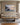 Cast All Your Anxiety on Him painting-style canvas hanging above a linen sofa in a bright living room