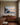 1 Peter 5:7 painting-style canvas wall art above a walnut sideboard in a dining room