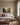 Fruit of the Spirit orchard canvas hanging above an oatmeal linen sofa in a bright family living room