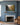 Painting-style Galatians 5:22-23 canvas centered over a slate blue fireplace mantel with a marble surround
