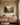 Orchard painting-style canvas with the fruit of the Spirit verse above an oak sideboard set with a bowl of red apples in a breakfast room