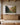 Largest 48x32 size of the apple orchard scripture canvas above a long oak sideboard in a beamed great room