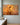 Impressionist oil painting canvas of Jesus with eyes closed resting both hands on one sheep's head in a golden flock, front view on a sage plaster wall