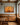 He Knows My Name canvas above a quarter-sawn oak sideboard with unlit beeswax candles in a Craftsman dining room